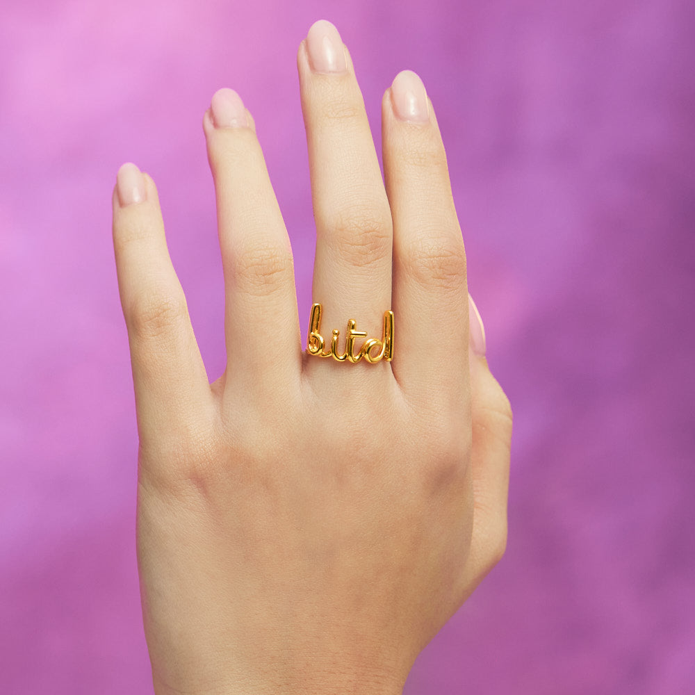 Bitch Hotscripts word wire ring by Hotlips by Solange in gold plated silver on hand