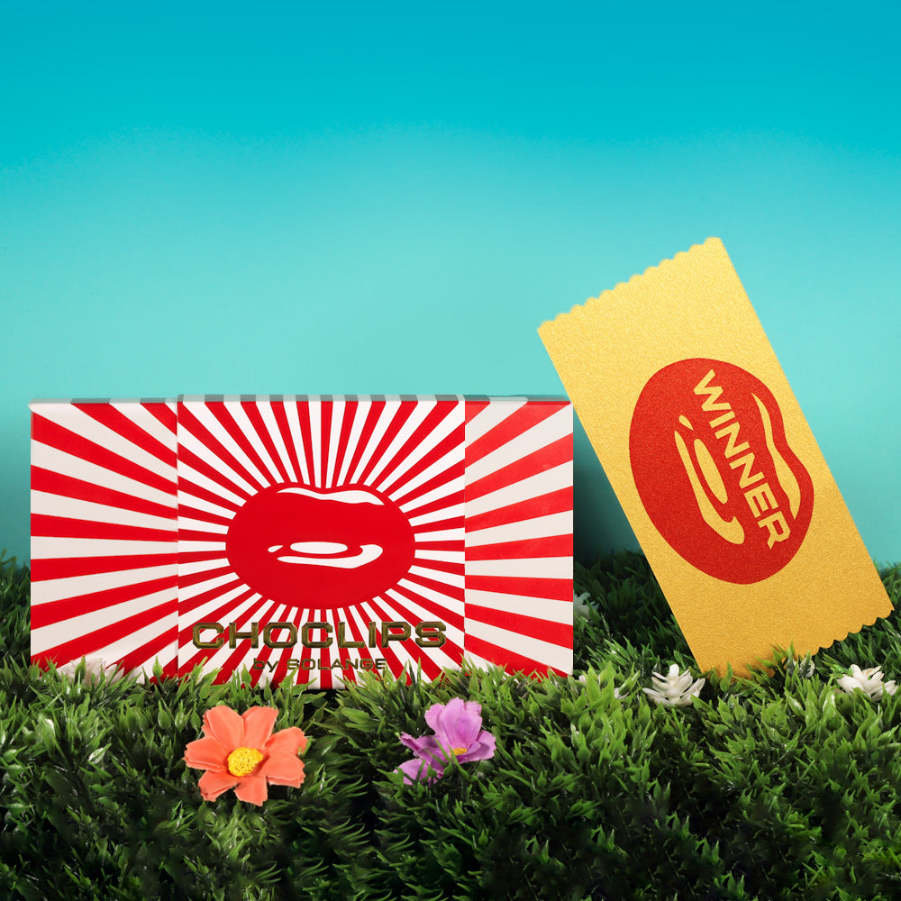 Chocolate kisses bar of chocolate with a chance to win a golden ticket inside by Hotlips by Solange on sunshine grass