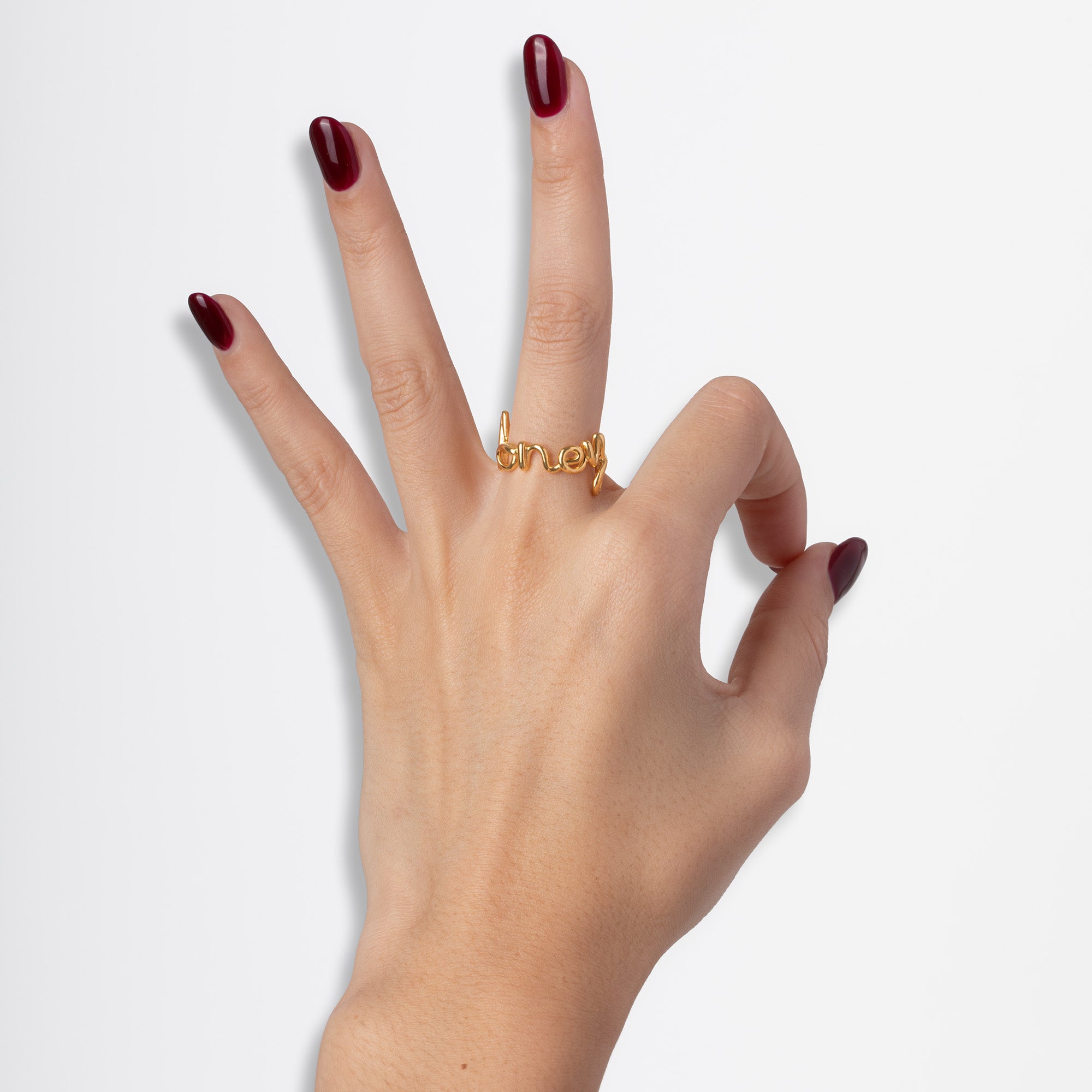 Honey Hotscripts word wire ring by Hotlips by Solange in gold plated silver on model