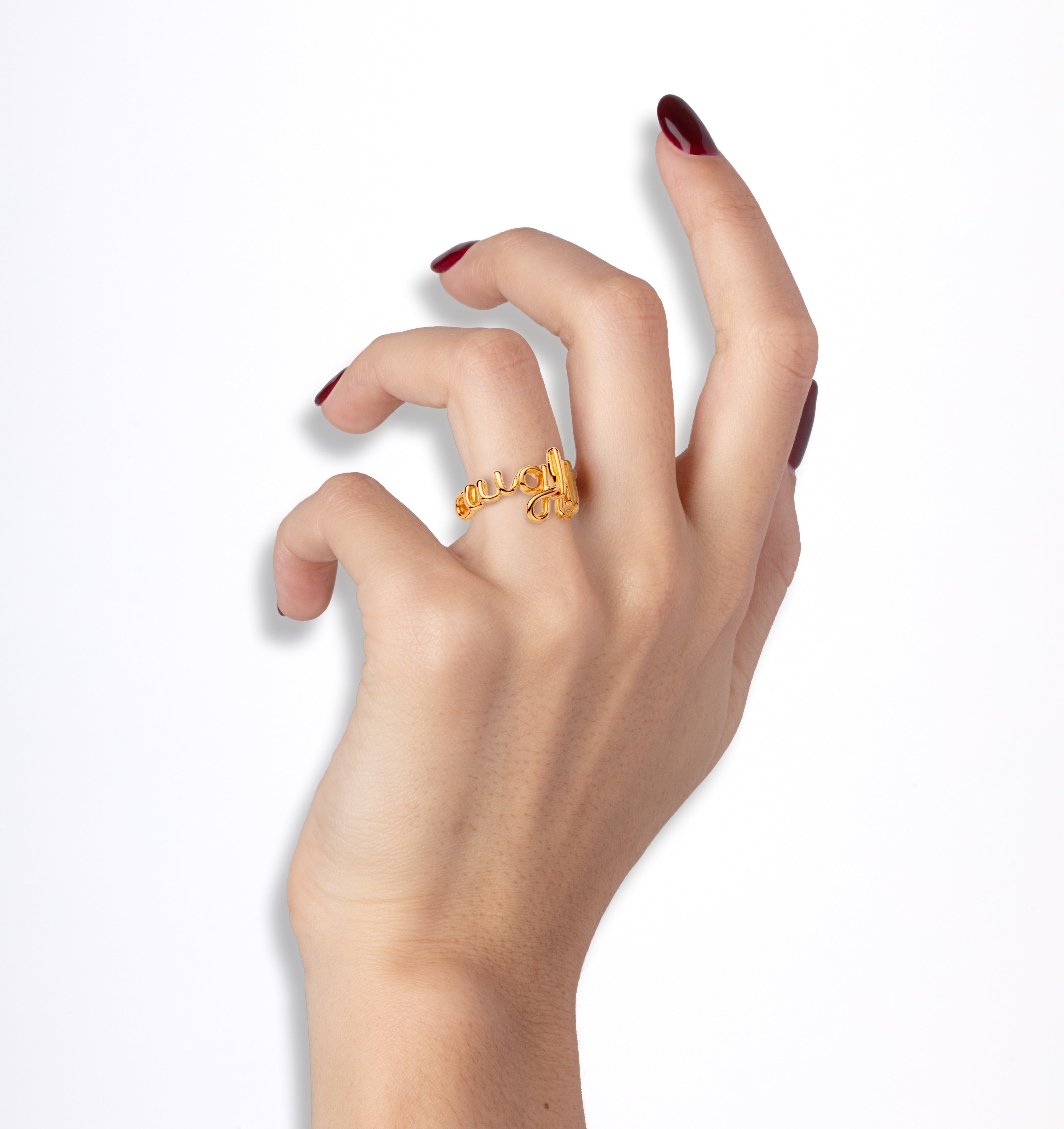 Naughty Hotscripts word wire ring by Hotlips by Solange in gold plated silver on model