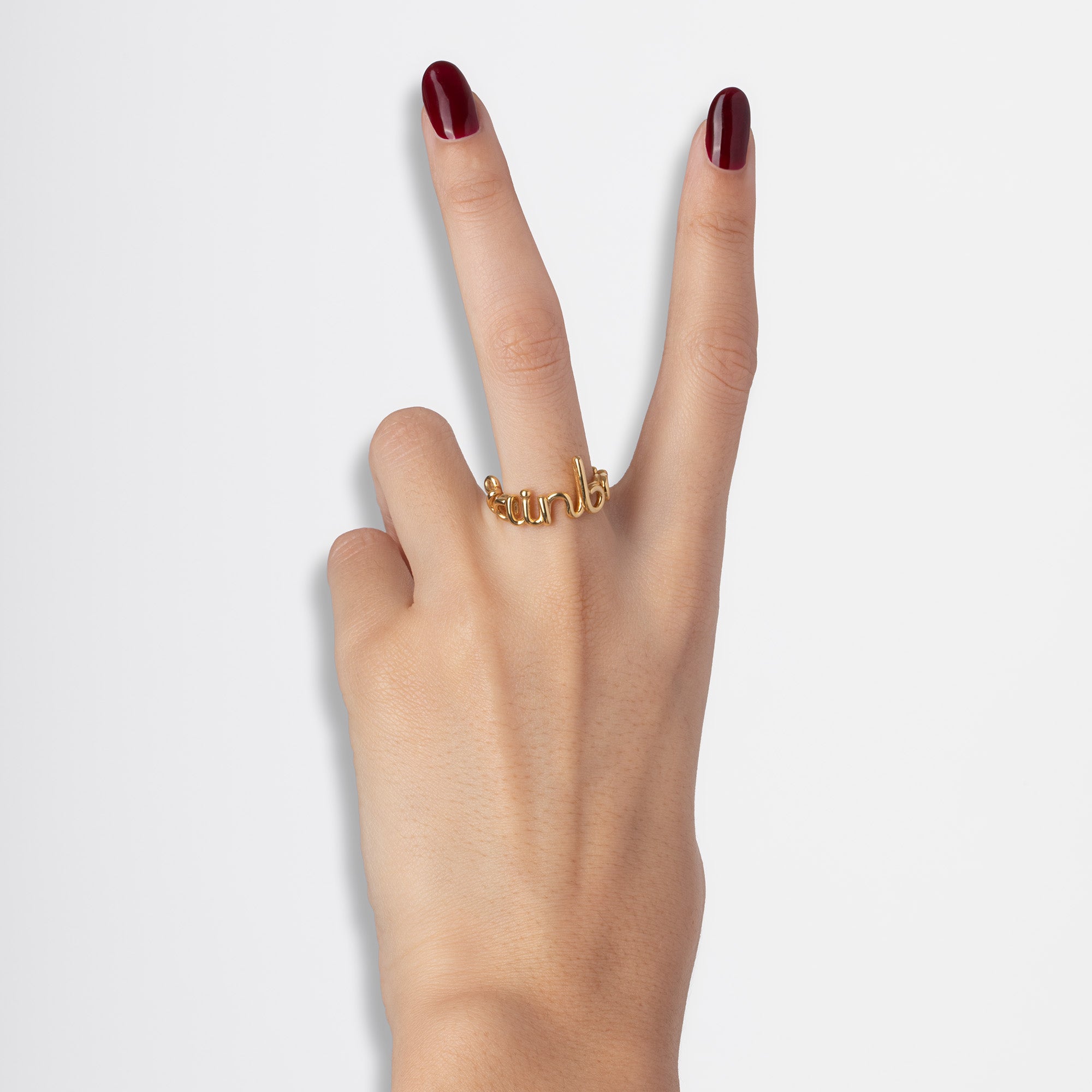 Rainbow Hotscripts word wire ring by Hotlips by Solange in gold plated silver on model