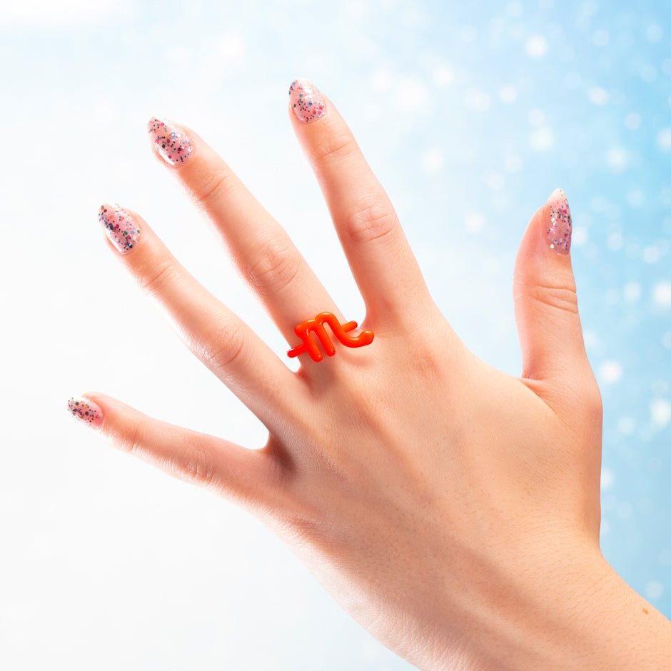 Scorpio Zodiac Hotglyph ring by Solange neon orange enamel and silver on hand