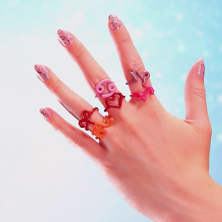 Hotglpyh Zodiac sign rings in silver and colourful enamel on hand by Hotlips by Solange