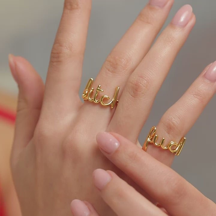 Bitch Hotscripts word wire ring by Hotlips by Solange in gold plated silver video on hand