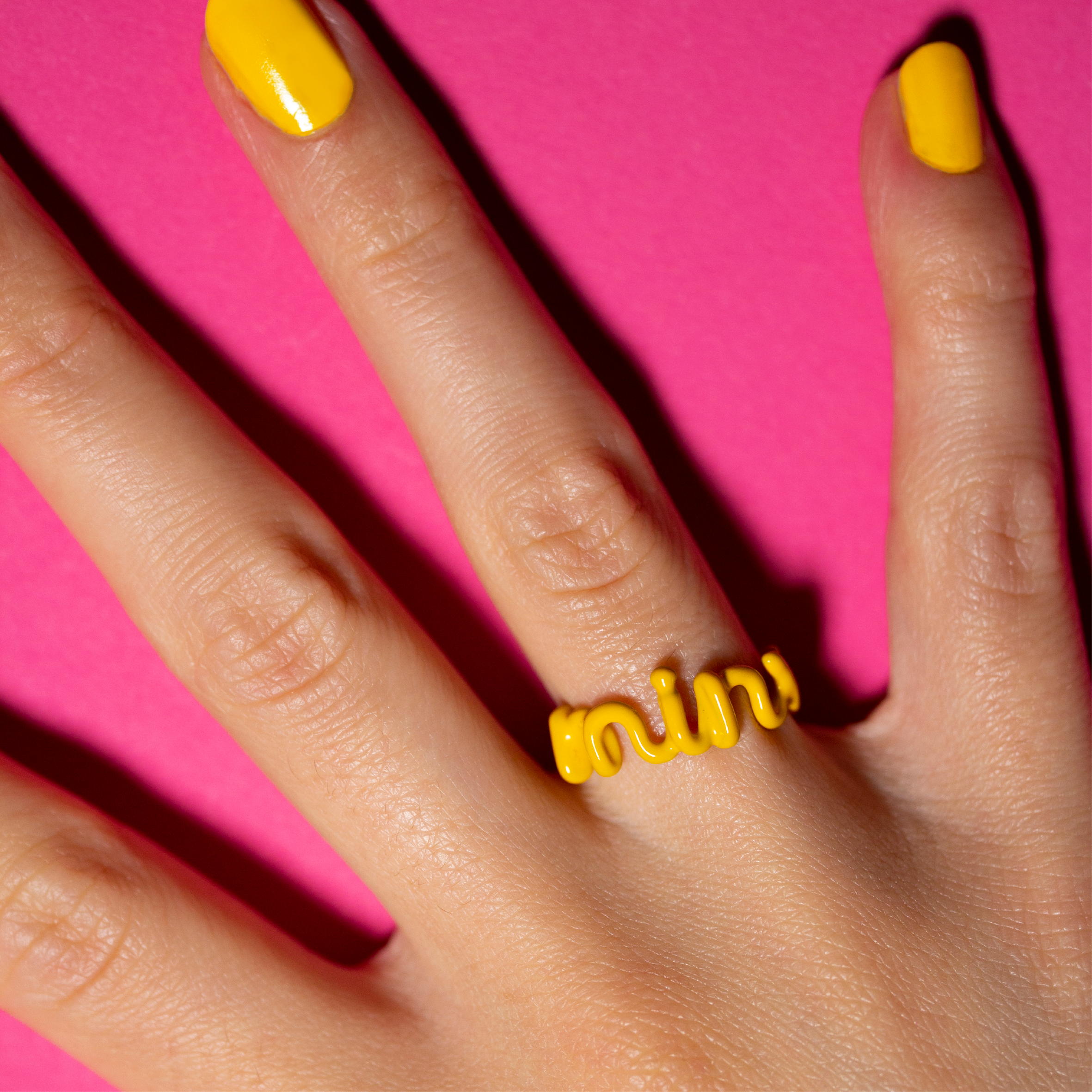 Minx banana yellow Hotscripts word ring by Solange on hand