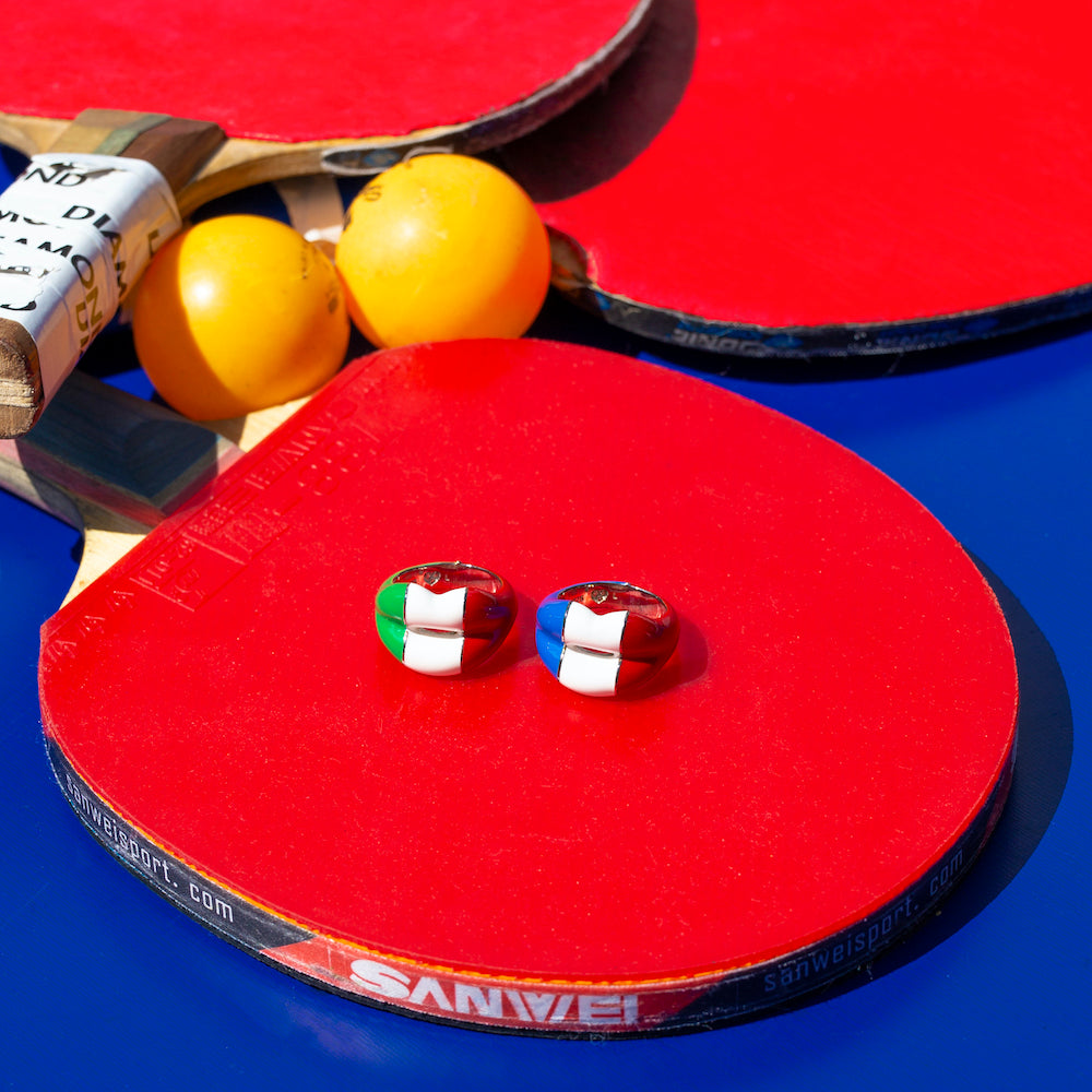 Tricolor hotlip ring by British designer Solange Azagury-Partridge on table tennis racket
