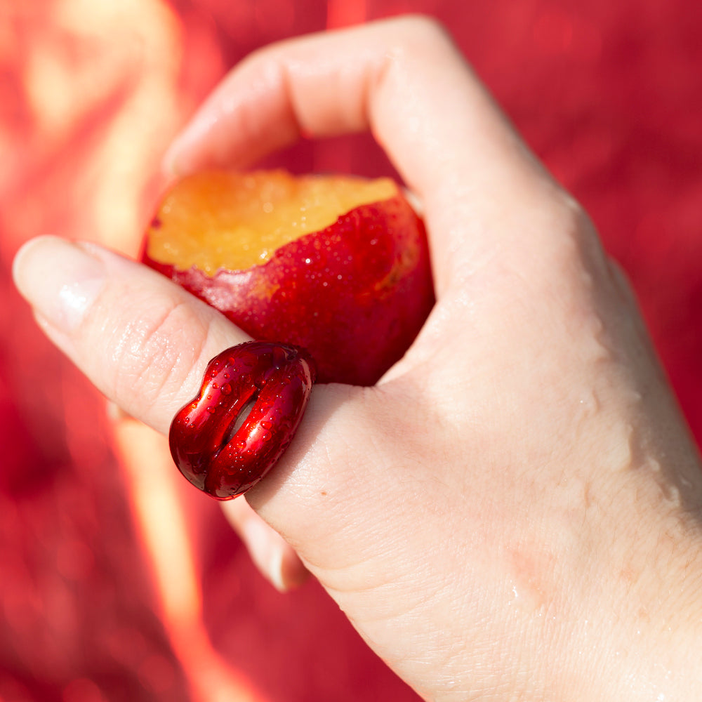 Juicy Red Hotlips ring by Solange on model with fruit