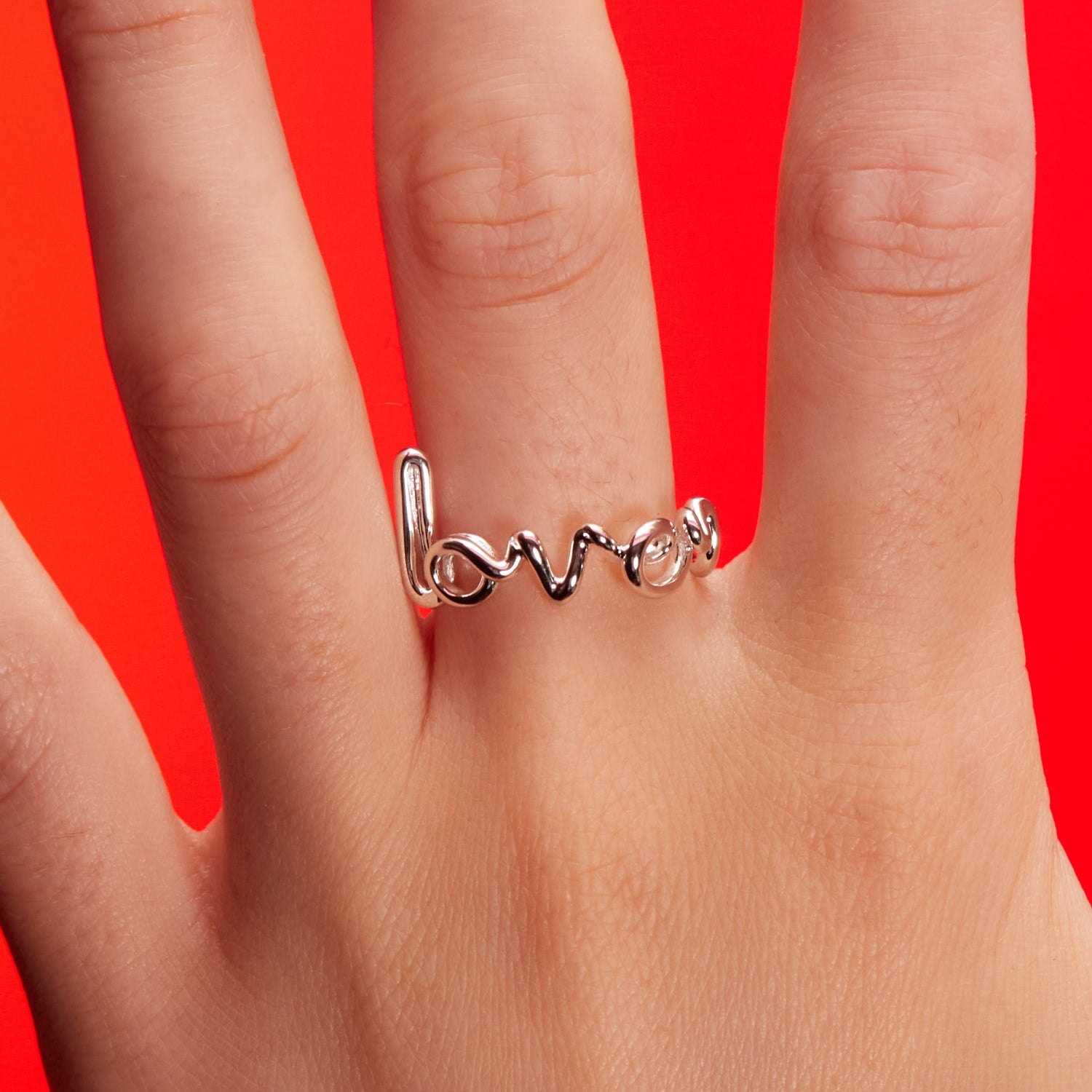 Lover Hotscripts ring in Silver front view on model