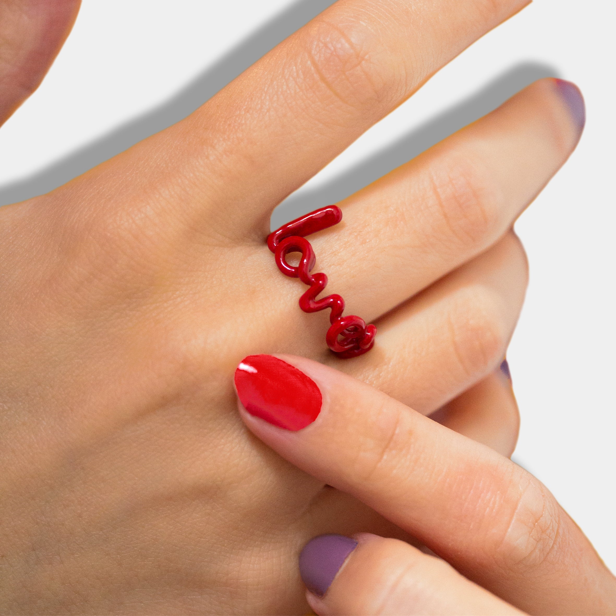 Lover Hotscripts ring in Classic Red enamel on hand