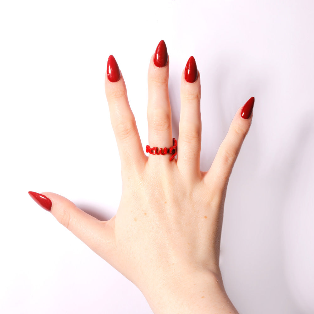 Naughty Hotscript by Solange ring in classic red enamel - front view on hand