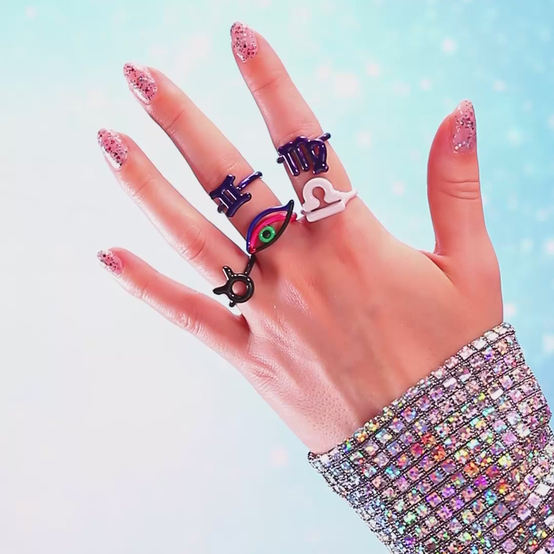 Hotglyph Zodiac and eye rings silver and enamel on hand model by Hotlips by Solange