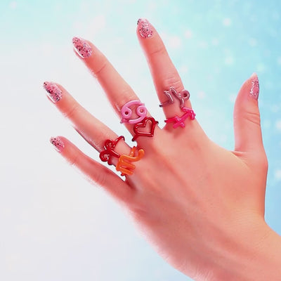 Hotglpyh Zodiac sign rings in silver and colourful enamel on hand by Hotlips by Solange
