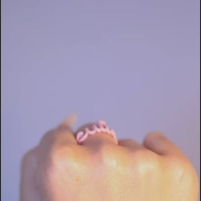 Cutie word Hotscript silver and pink enamel ring by Hotlips by Solange on models hands video of flipping off the bird