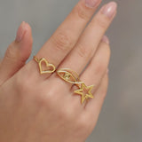 Heart Eye and Star Motif Rings in Gold Plated Sterling Silver Vermeil By Hotlips by Solange on hand
