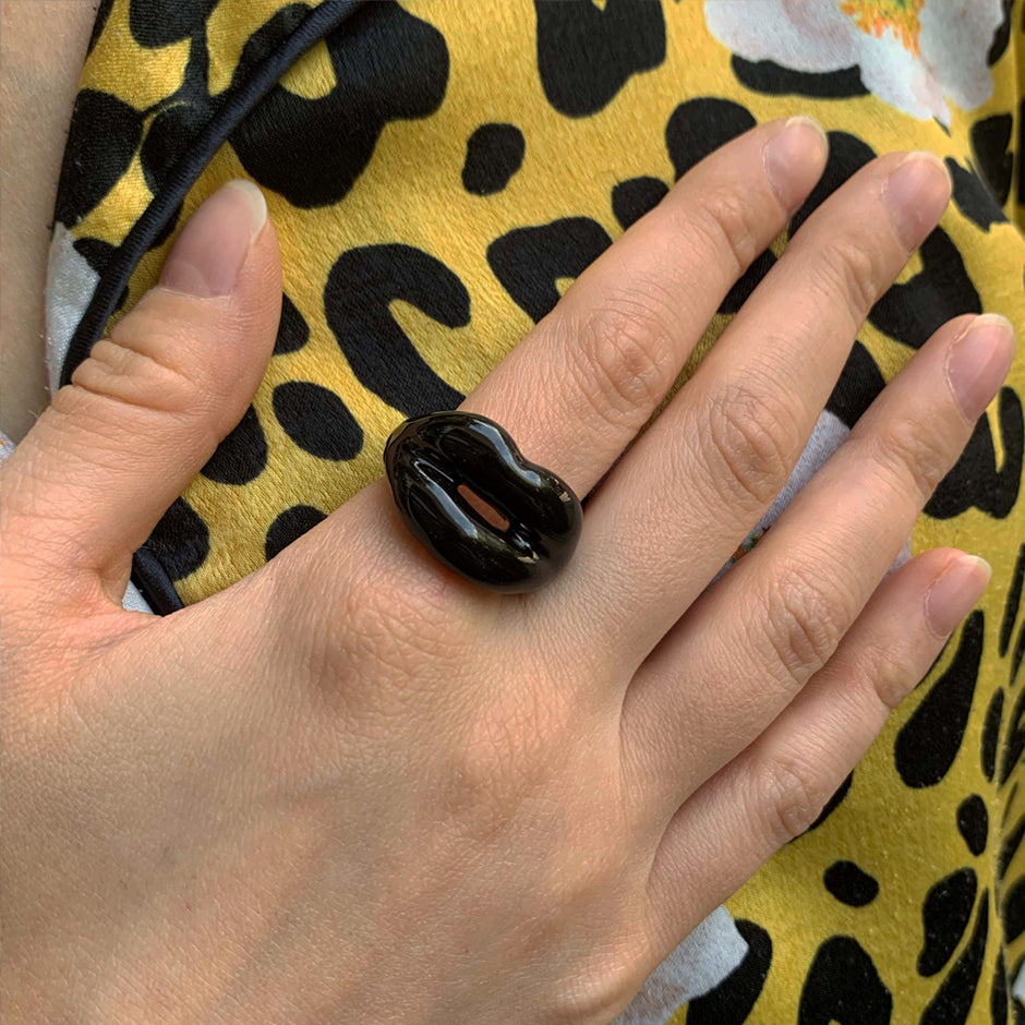 Black silver and enamel Hotlips ring on hand