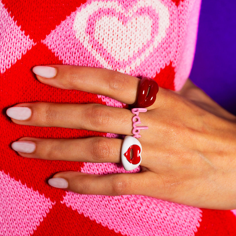 Loveheart classic red and babe hotlips hotscripts rings on hand heart jumper