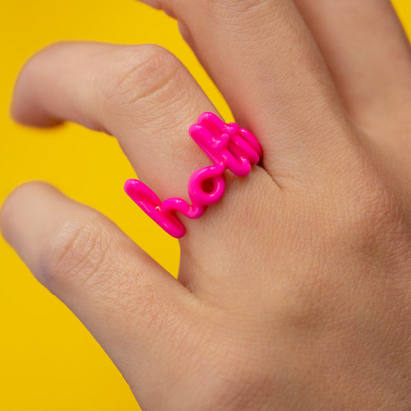 Hottie written word neon pink Hotscripts ring by Solange silver and enamel on hand