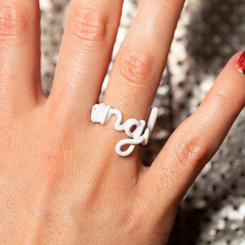Angel white enamel and silver Hotscripts ring on hand