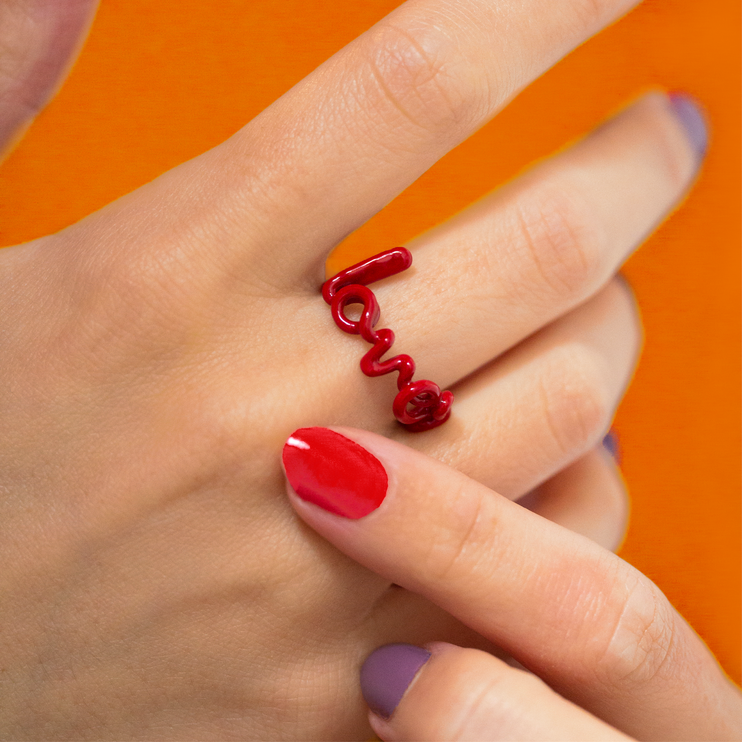 Lover Hotscripts ring in Classic Red enamel on hand