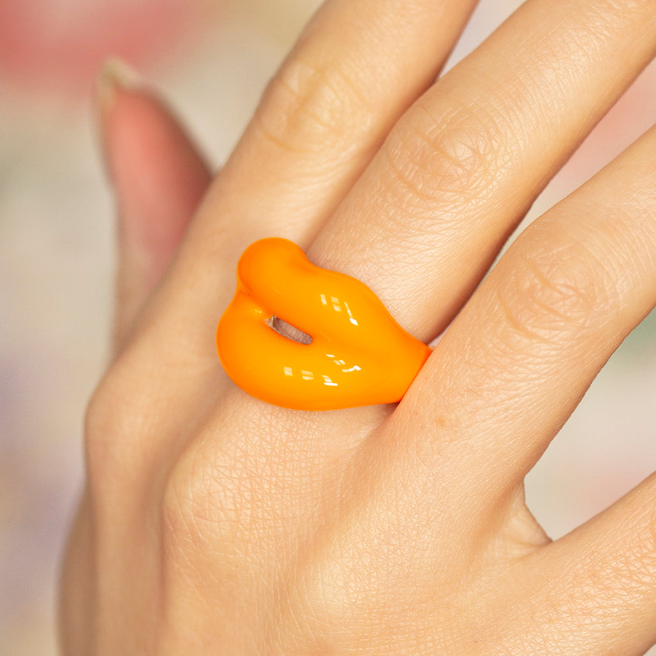 Pastel Orange Hotlips ring by Solange on hand