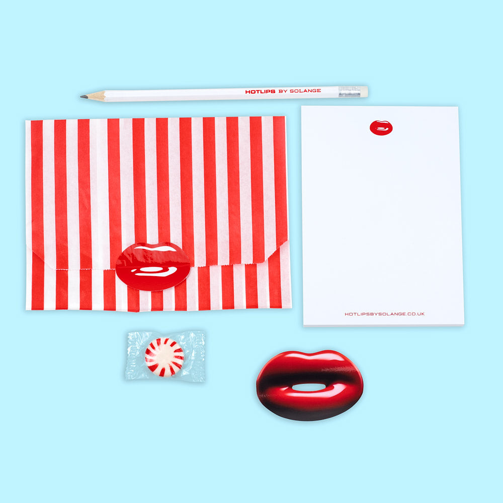 Take Note Set Hotlips by Solange Branded Notepad Pencil and Sticker Set in Striped Red Bag Flat Lay on Blue Background