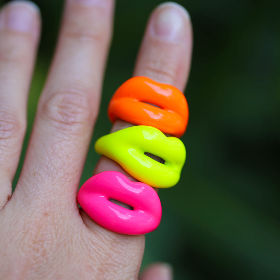Neon Orange Yellow and Pink Hotlips rings on hand