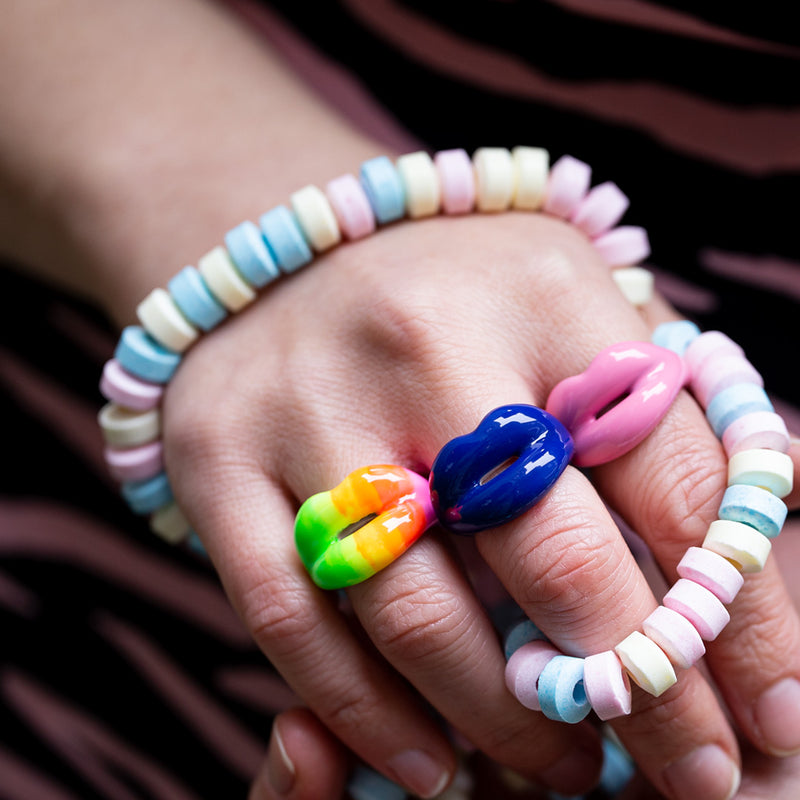 Neon Rainbow Royal blue Bubblegum pink on hand with candy necklace