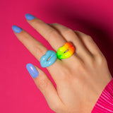 Neon Rainbow and pastel blue hotlips ring on hand