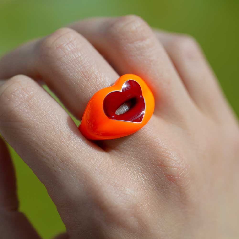 Neon Orange Loveheart Hotlips ring on hand