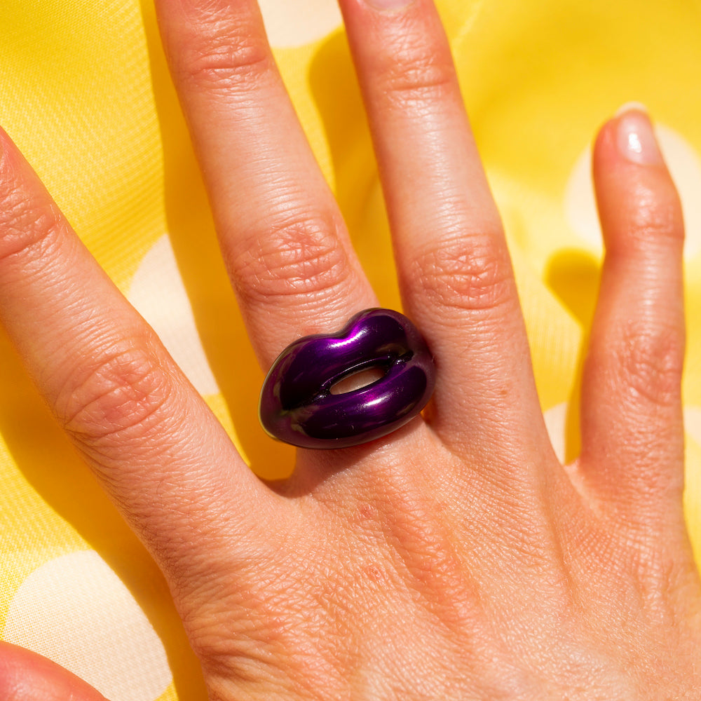 Purple silver and enamel hotlips ring on hand